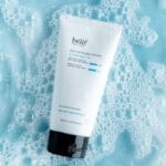 belif Jelly-to-Foam Cleanser 160ml - Gentle facial cleanser with hyaluronic acid & herbs. Product in the bathroom, foamy background. 