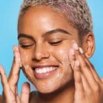 belif Cleansing Balm 100ml - Moisturizing make-up removing balm with lotus flower & vitamin E. Picture with woman using the product